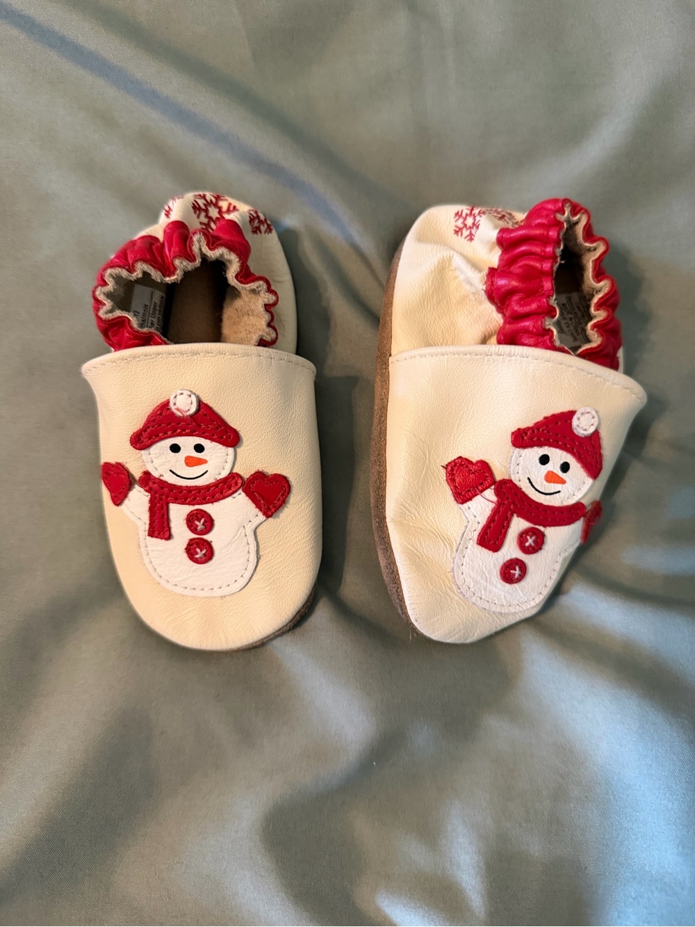 Robeez White Leather Baby Slip-Ons with Red Snowman Appliqué